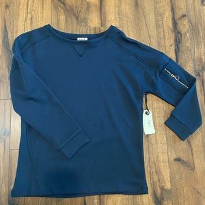 3/4 sleeve sweatshirt with zipper accent. Sweatshirt material, flattering fit.